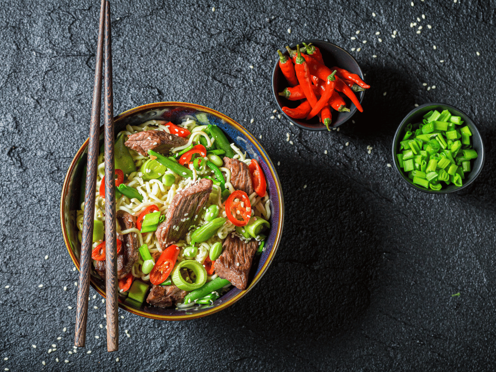 Asian cuisine - Dish with noodles, vegetables and meat
