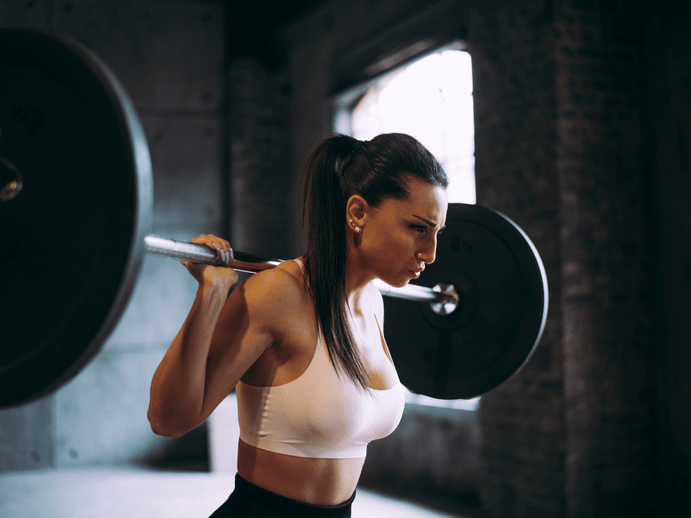 The girl is training with weights.