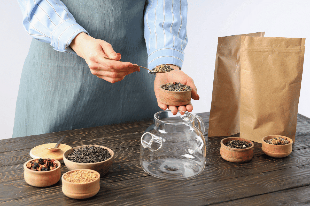 A woman is preparing tea.
